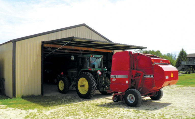 Tractor entering agricultural hangar