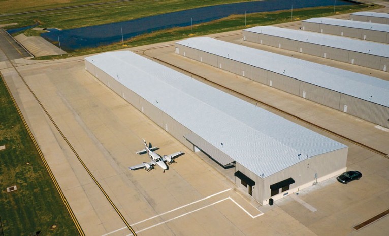 Plane by Bi-Fold Airplane Hangar Door